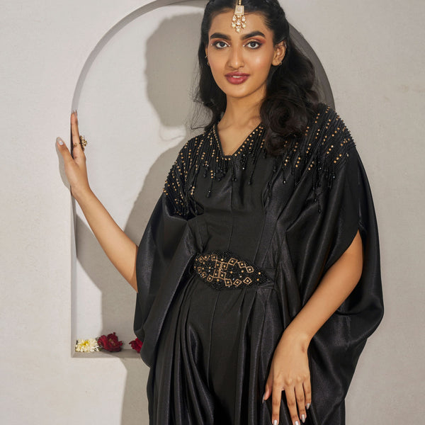 Devnadi -<br>Satin silk cowl jumpsuit, highlighted with bead embellishments on the shoulder and belt