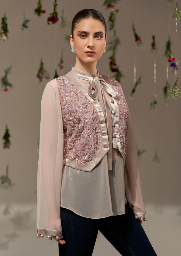 Top with frill and satin bow detailing and an embroidered waist coat