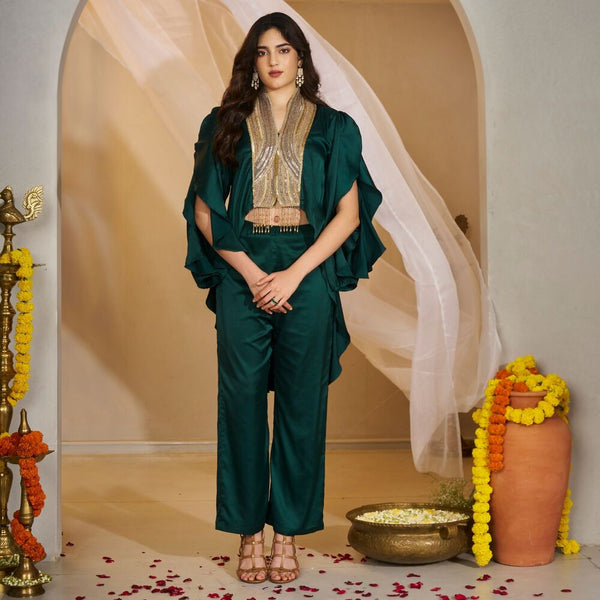 Mandakini -<br>Structured liquid silk top with frilled sleeves and an embellished golden panel, paired with matching box-pleated flared pants