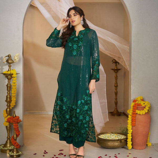 Janvii -<br>Long embroidered tunic in sequin georgette and organza with delicate floral motifs, styled with liquid silk pants and a coordinated inner