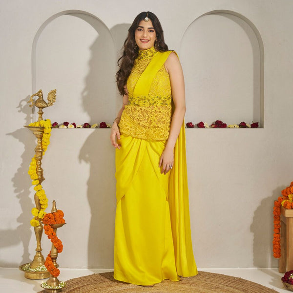 Shubhra - <br>Cutwork peplum incut top with an embroidered collar and belt, paired with a draped linen-silk saree skirt